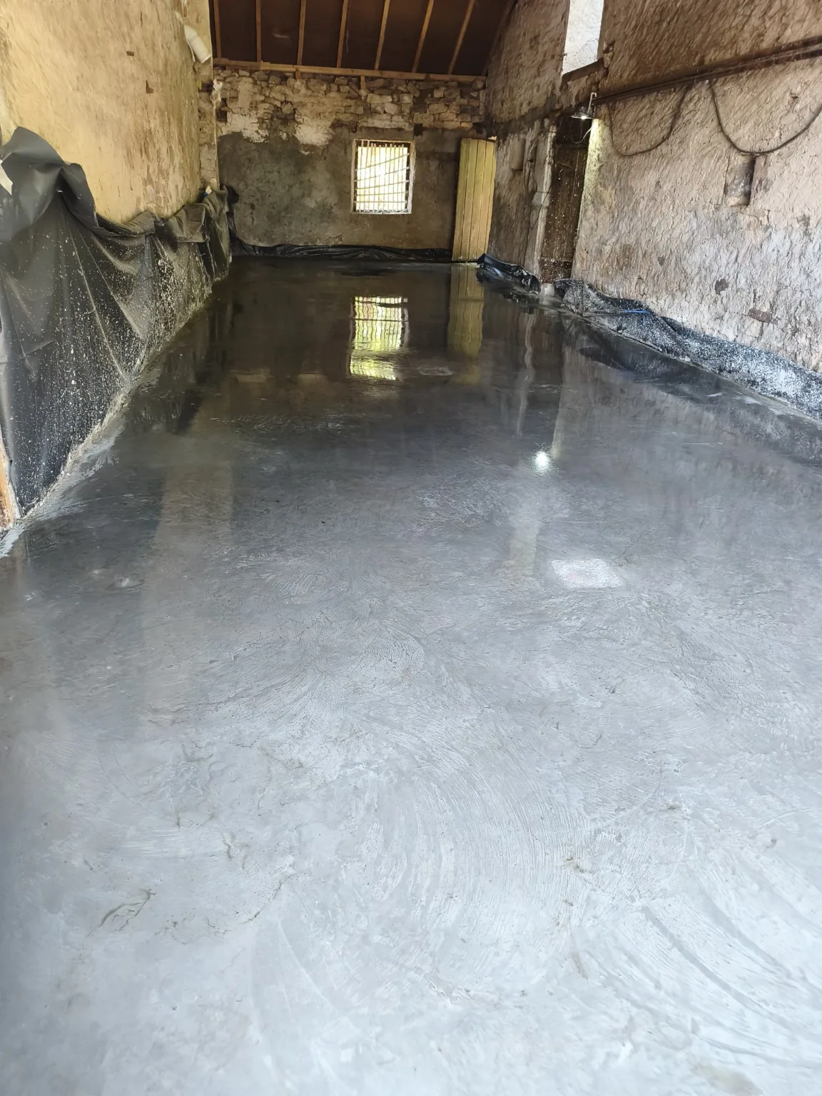 Réalisation d’une dalle béton dans un bâtiment ancien